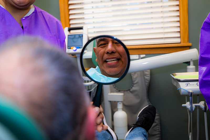 Patient smiling confidently after their dental procedure